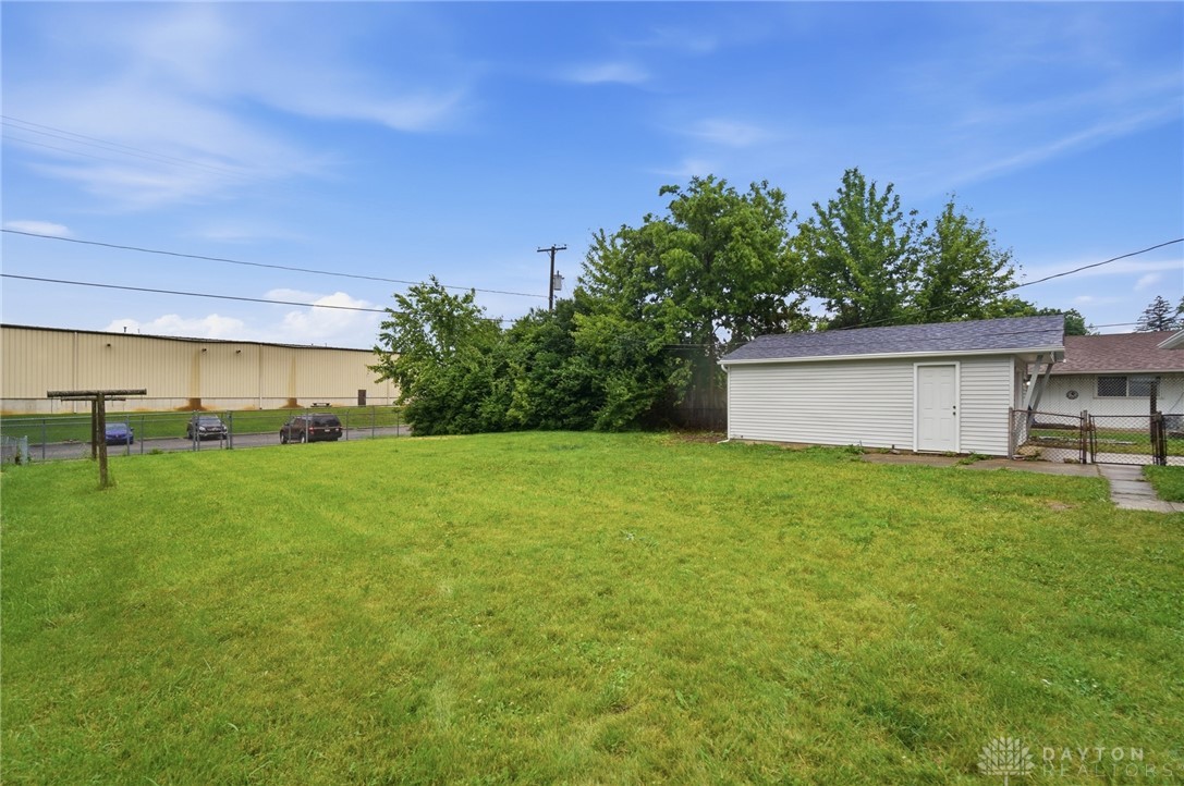 1923 Portage Path Springfield, OH 45506 - Photo 37 of 40 A well-maintained yard provides ample outdoor space, complemented by a detached storage shed for convenience.