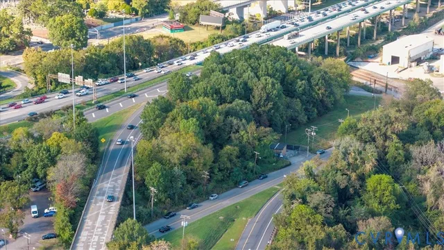 a view of street with yard and green space