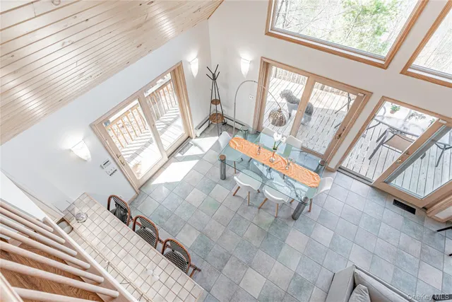 a view of living room with furniture and a large window
