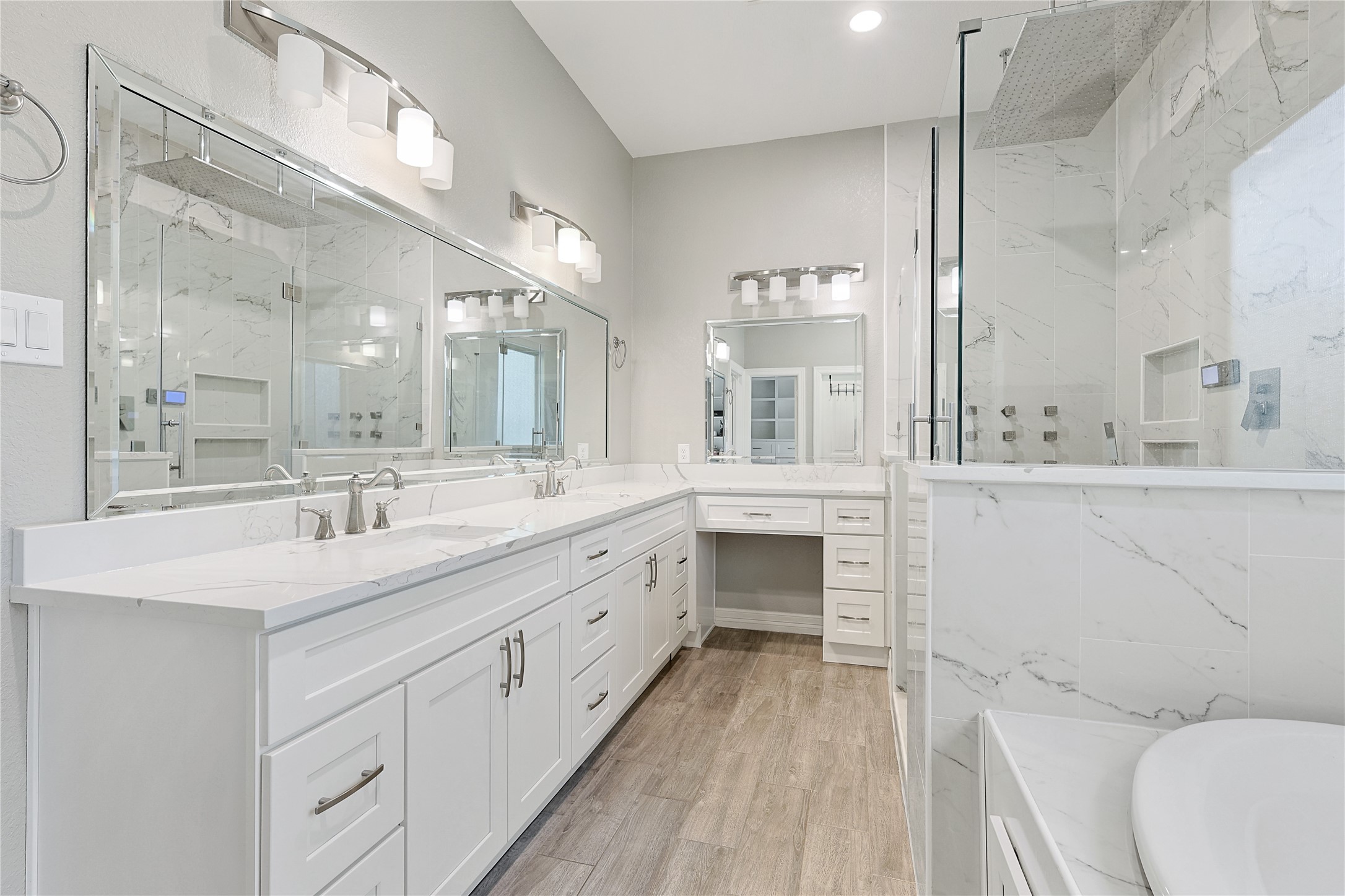 642 Parthenon Place New Caney, TX 77357 - Photo 12 of 30 a bathroom with a sink a toilet a mirror and vanity