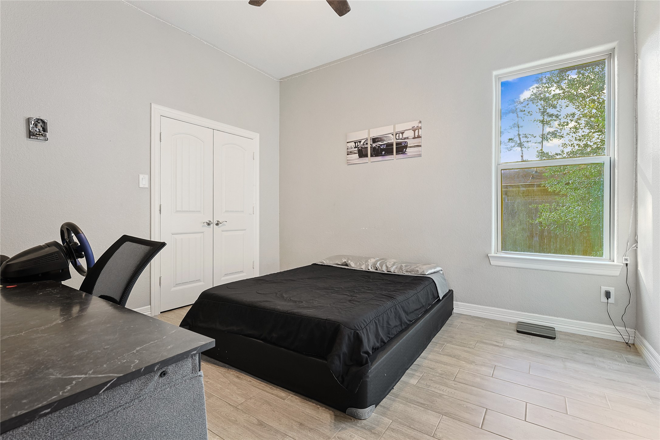 642 Parthenon Place New Caney, TX 77357 - Photo 17 of 30 a bedroom with a bed and a window
