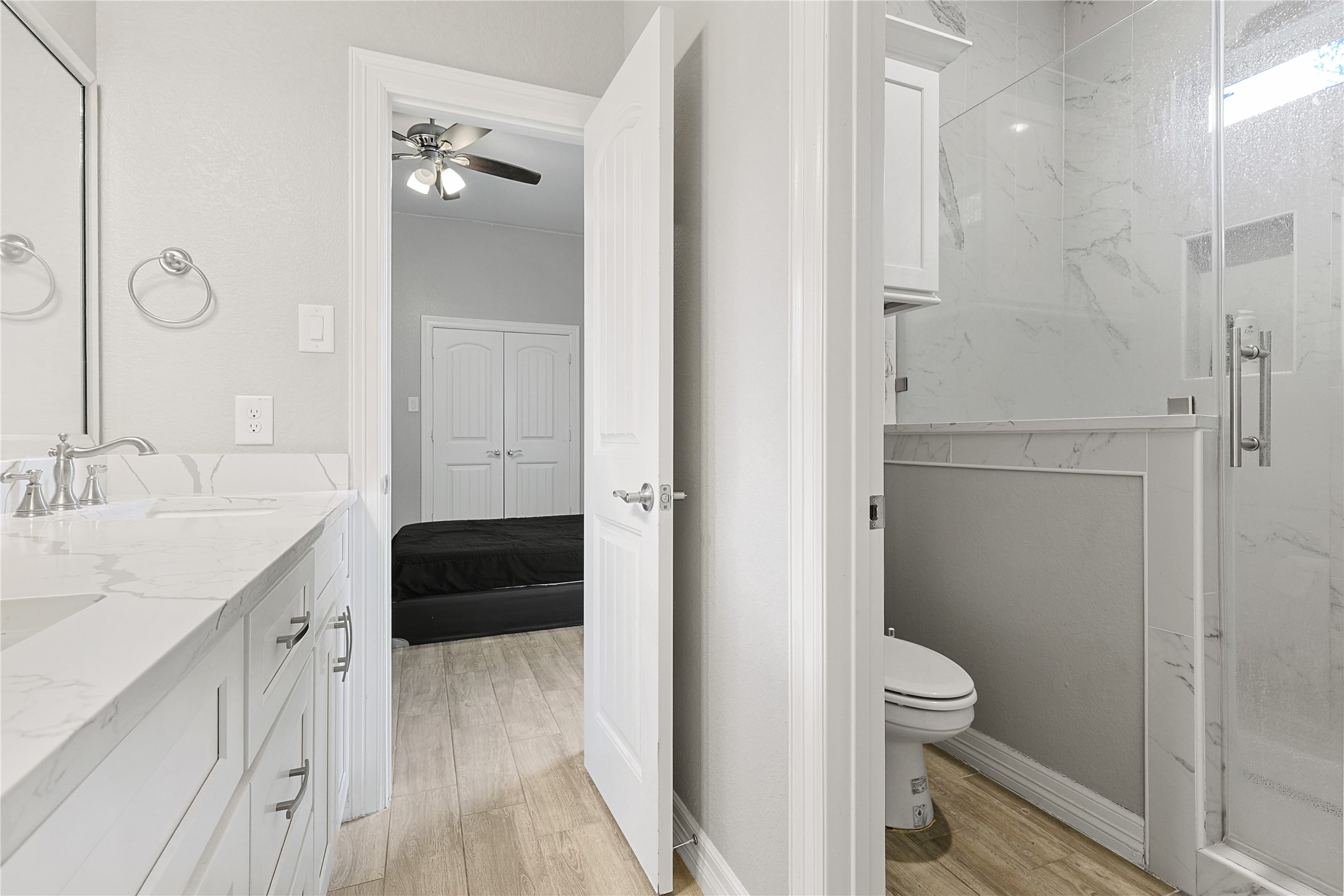 642 Parthenon Place New Caney, TX 77357 - Photo 18 of 30 a bathroom with a sink a toilet a shower and a mirror