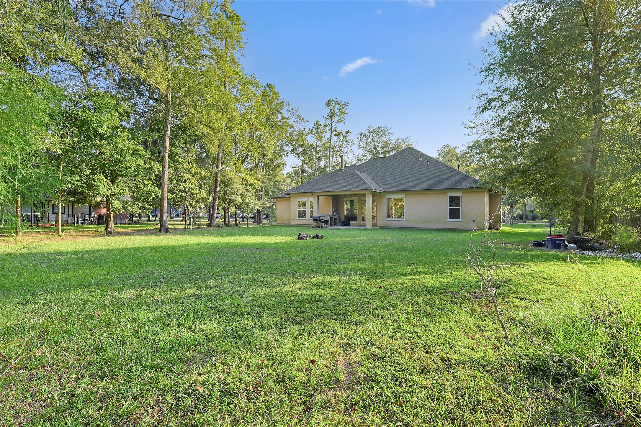642 Parthenon Place New Caney, TX 77357 - Photo 25 of 30 a front view of a house with garden