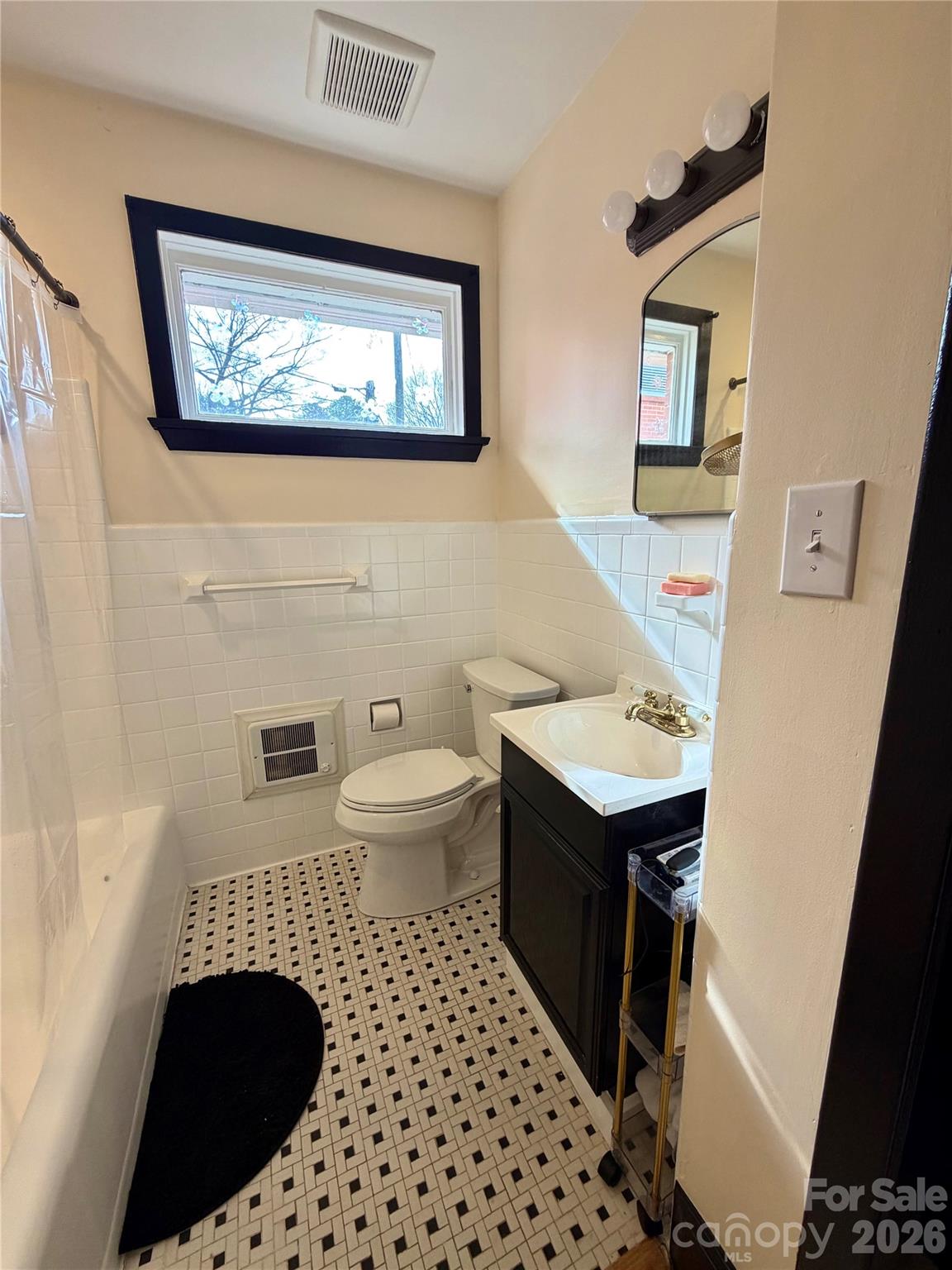 4232 Randolph Road Charlotte, NC 28211 - Photo 11 of 16 a bathroom with a sink and a mirror
