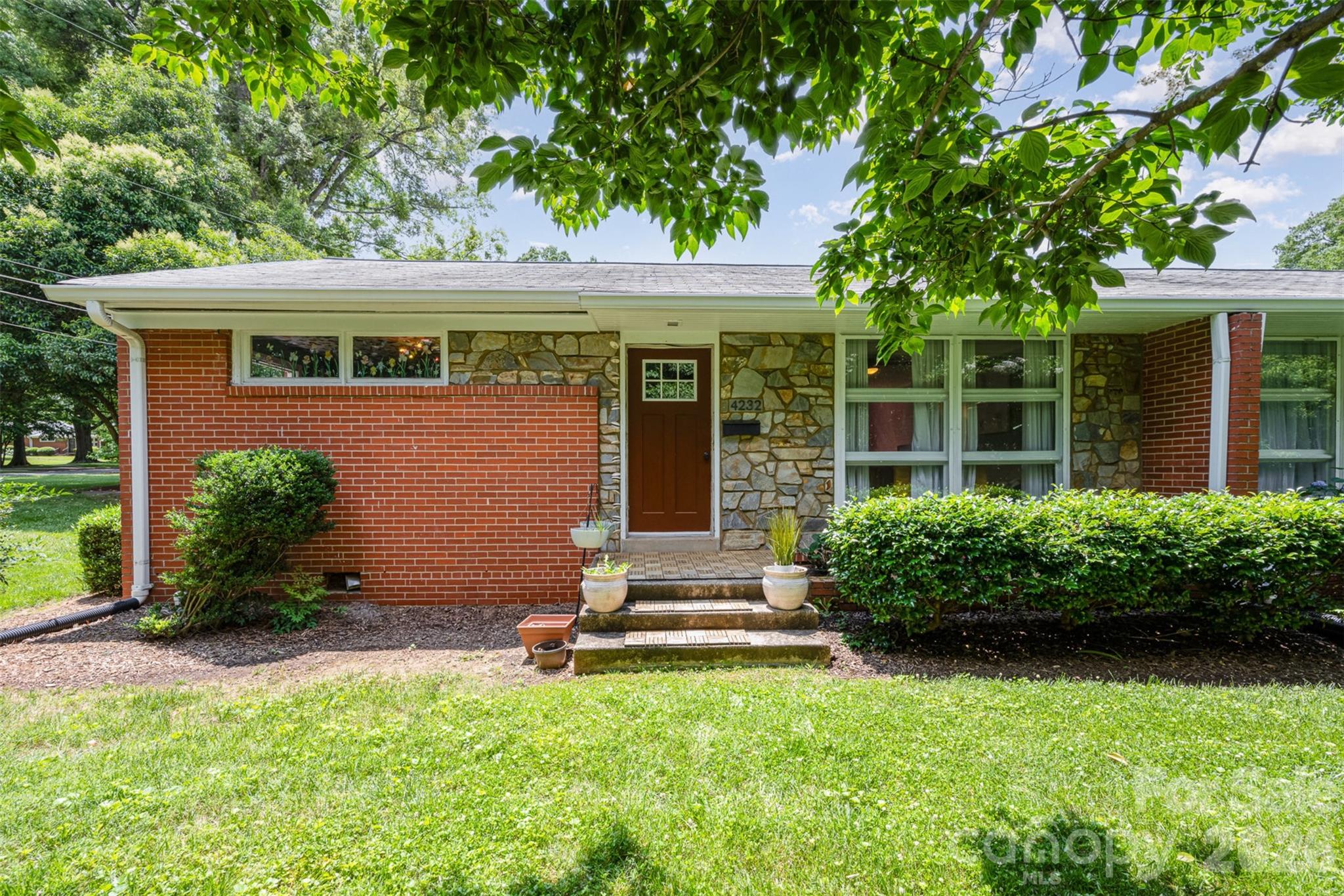 4232 Randolph Road Charlotte, NC 28211 - Photo 12 of 16 front view of a house with a yard