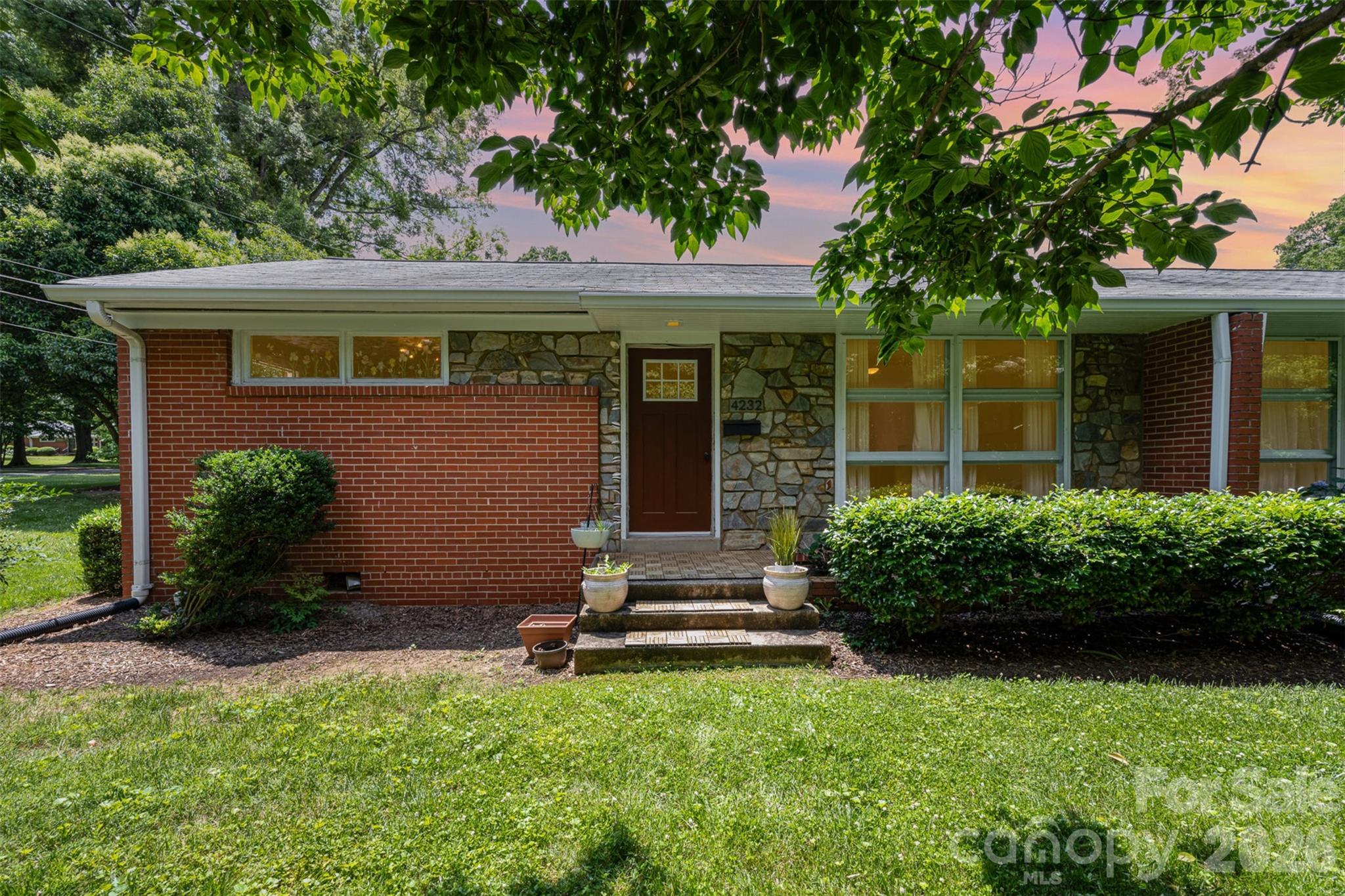 4232 Randolph Road Charlotte, NC 28211 - Photo 13 of 16 front view of a house with a yard