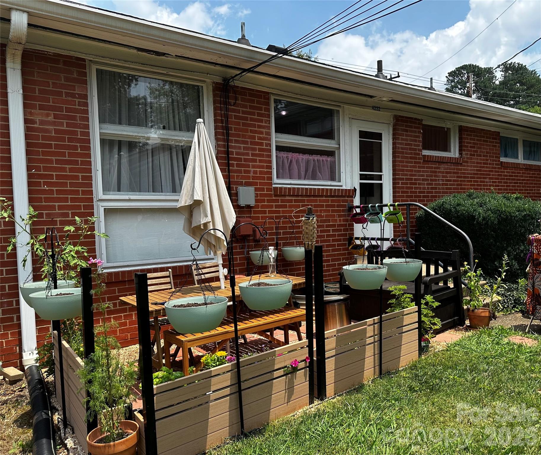 4232 Randolph Road Charlotte, NC 28211 - Photo 16 of 16 a backyard of a house with yard and outdoor seating