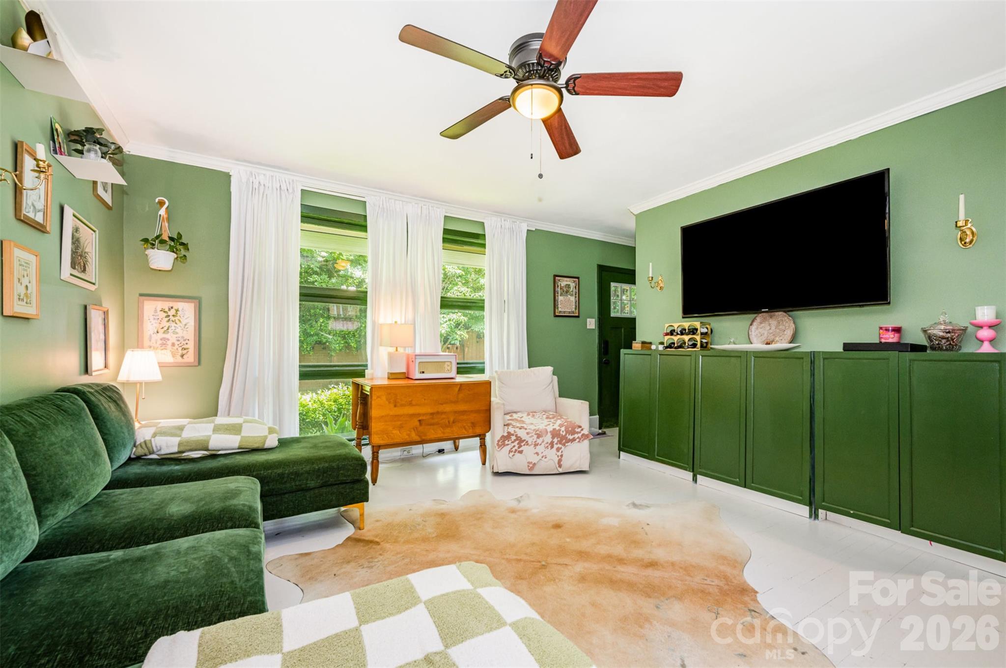 4232 Randolph Road Charlotte, NC 28211 - Photo 3 of 16 a living room with furniture and a flat screen tv
