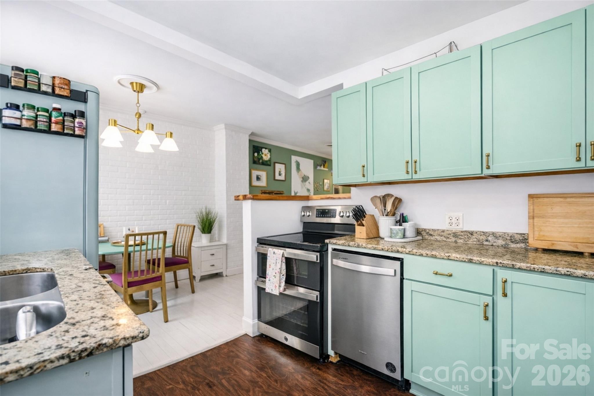 4232 Randolph Road Charlotte, NC 28211 - Photo 4 of 16 a kitchen with granite countertop a sink stainless steel appliances and cabinets