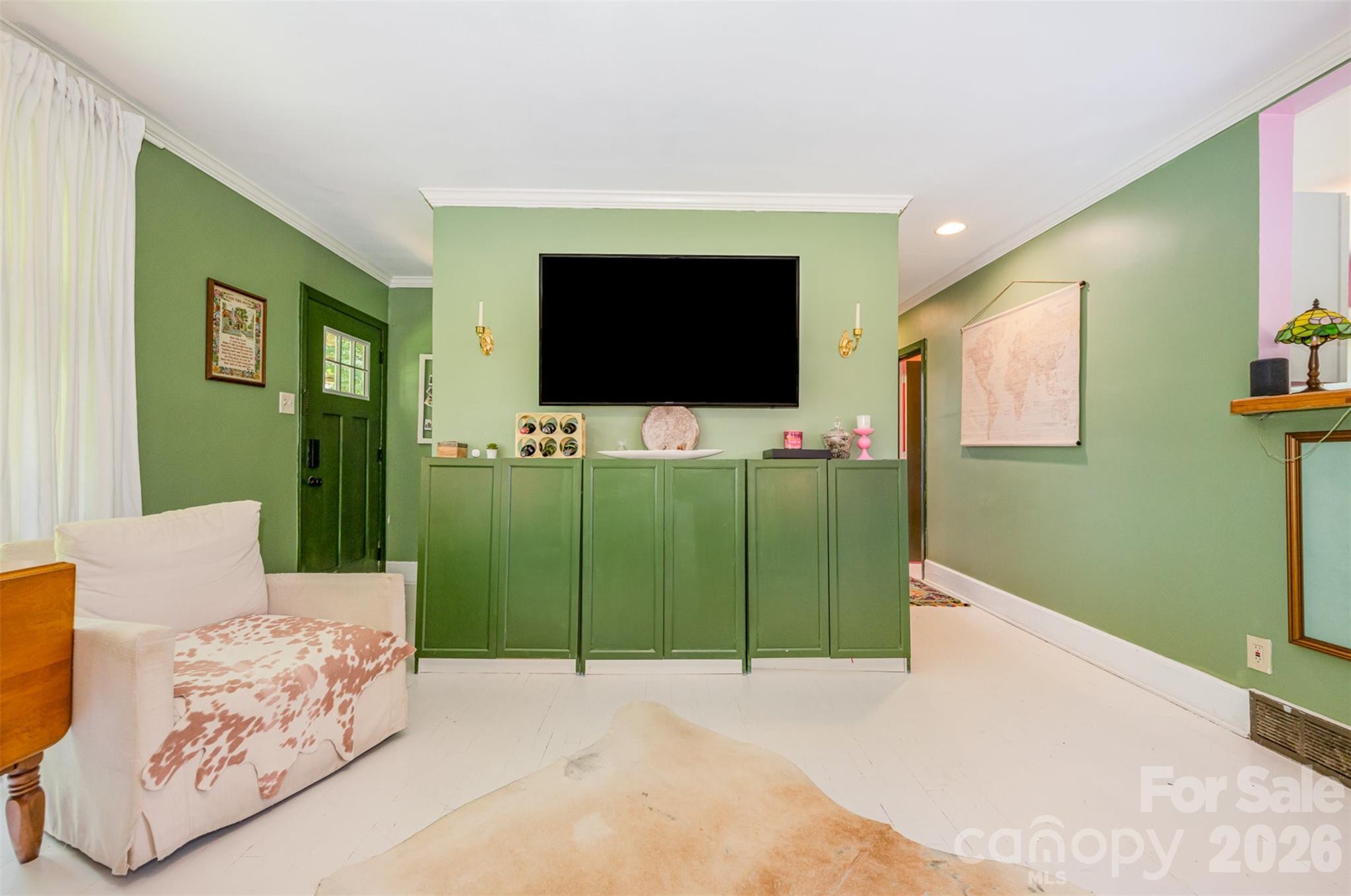 4232 Randolph Road Charlotte, NC 28211 - Photo 5 of 16 a living room with furniture and a flat screen tv