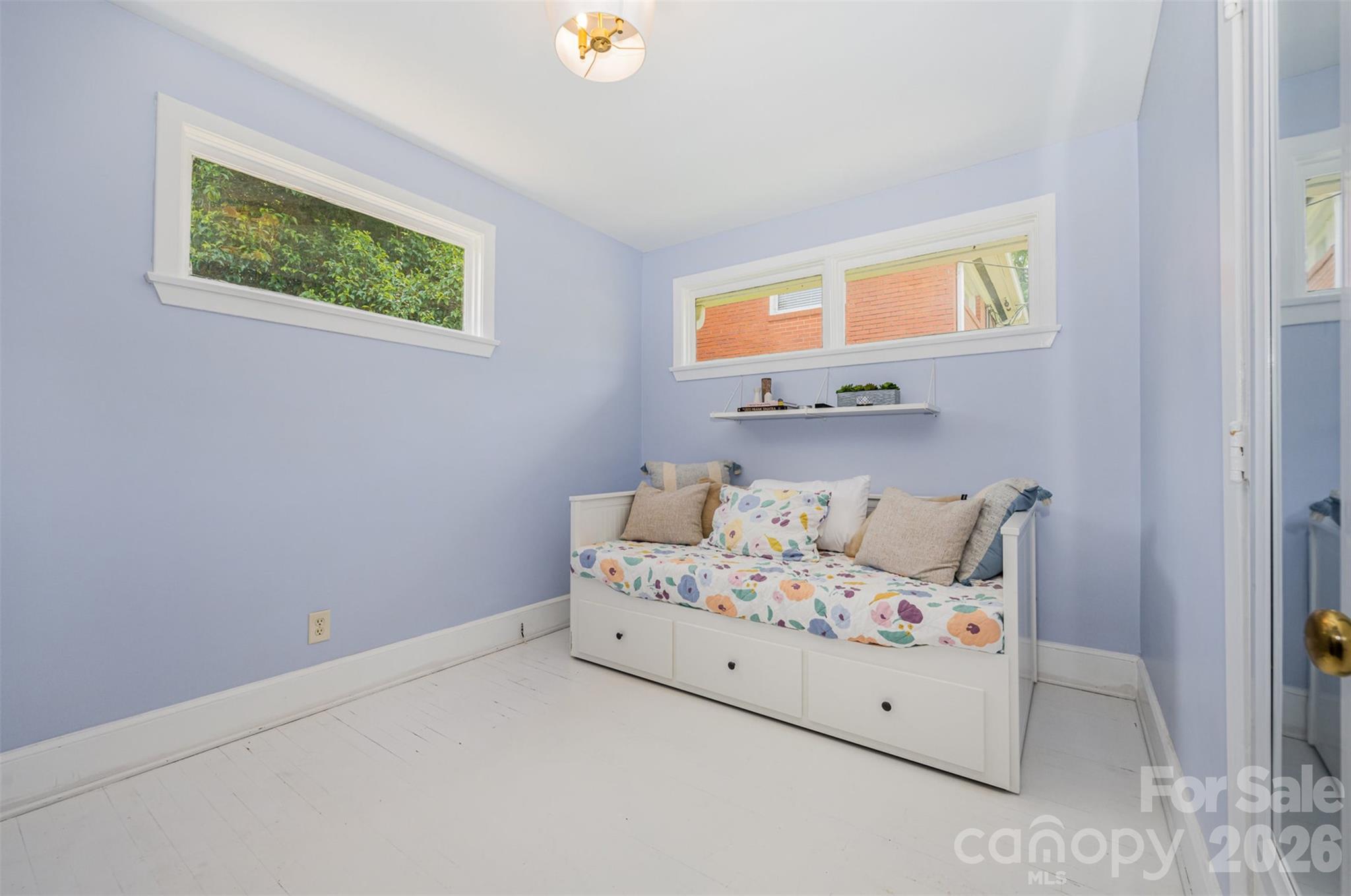 4232 Randolph Road Charlotte, NC 28211 - Photo 7 of 16 a bedroom with a bed and a window