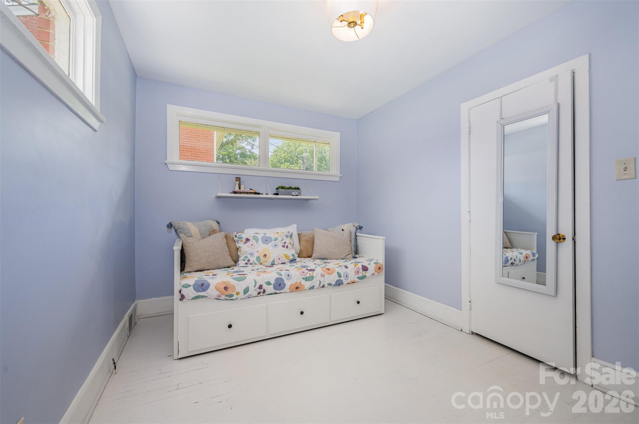 4232 Randolph Road Charlotte, NC 28211 - Photo 8 of 16 a room with a bed and a window