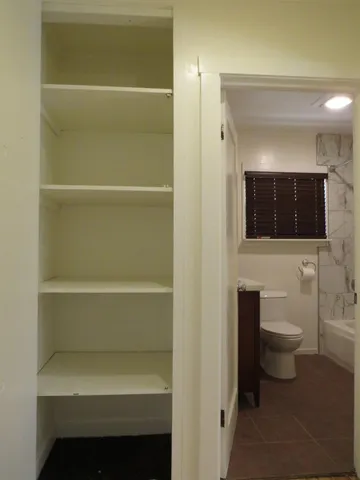a bathroom with a toilet and a sink