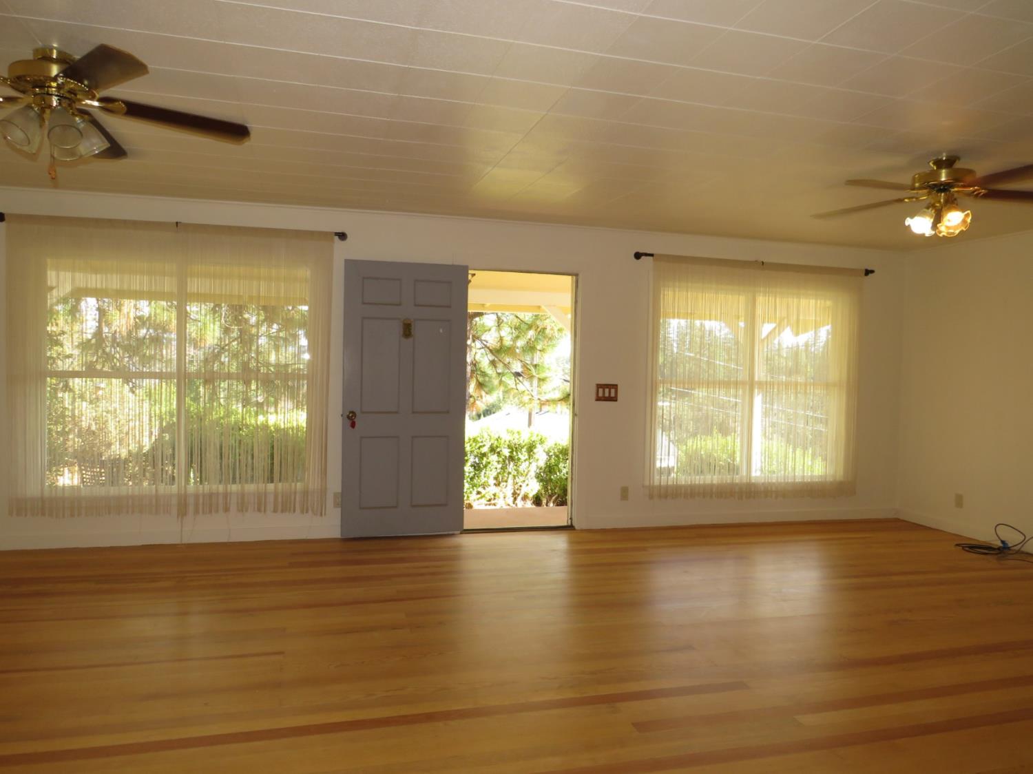 320 Pleasant Street Colfax, CA 95713 - Photo 3 of 49 a view of an empty room with a window