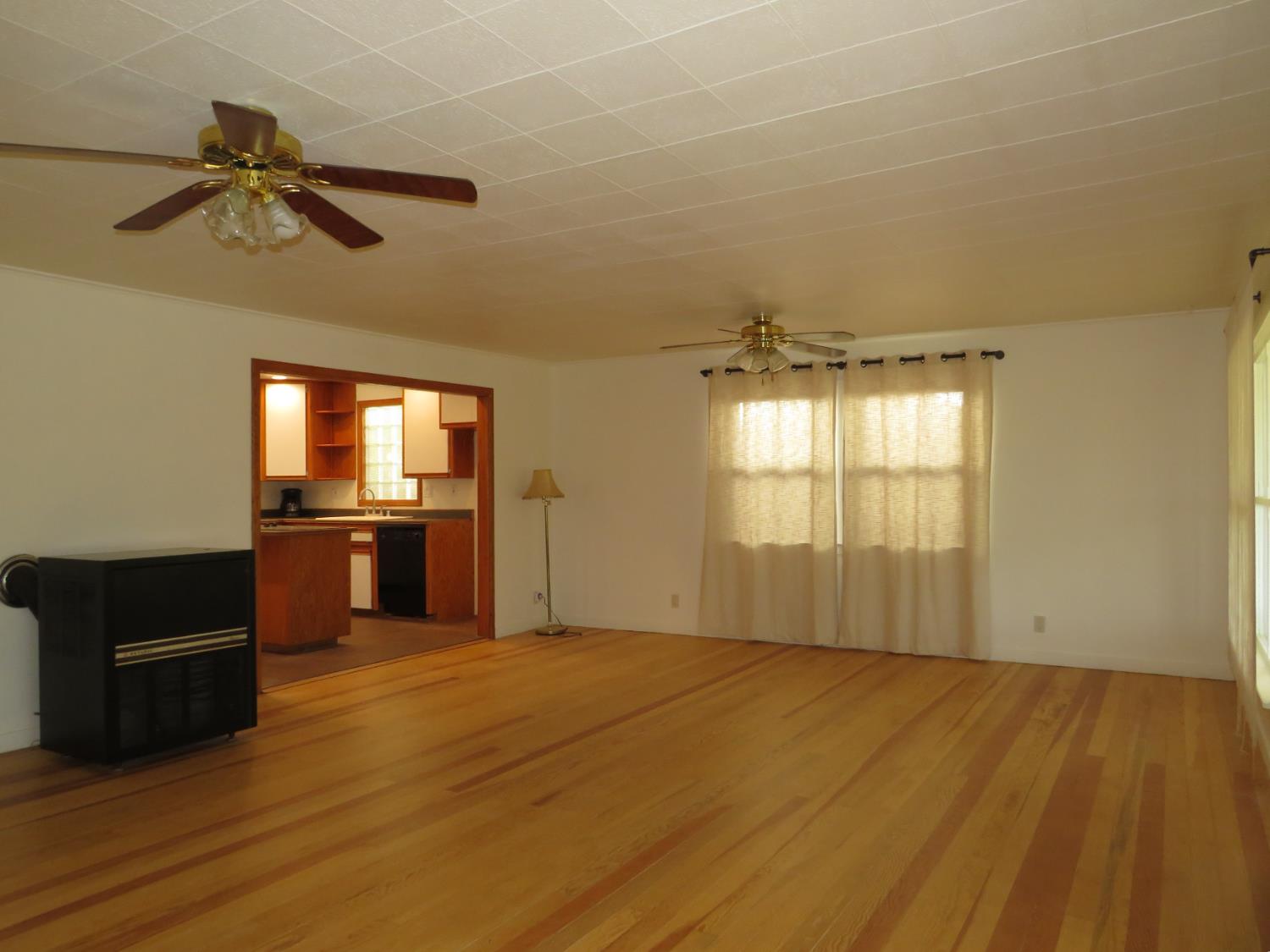 320 Pleasant Street Colfax, CA 95713 - Photo 6 of 49 a view of an empty room and a kitchen