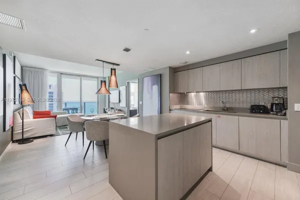 a kitchen with counter top space cabinets and stainless steel appliances