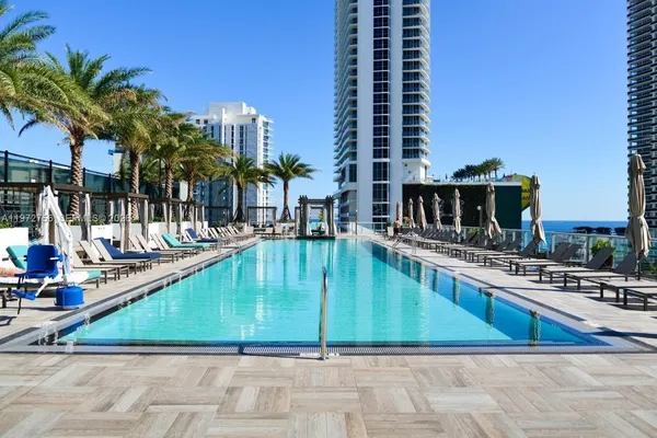 a view of a swimming pool with a lounge chairs
