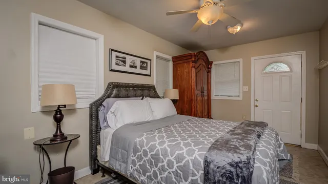 a bedroom with a bed and a lamp