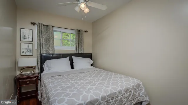 a bedroom with a large bed and a window