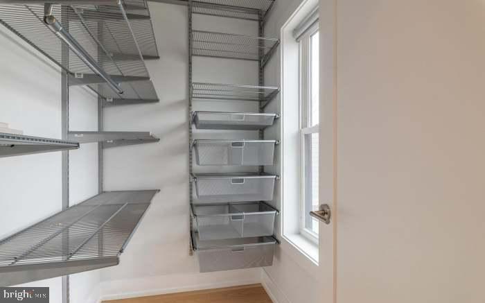 628 I Street Northeast, Unit 3 Washington, DC 20002 - Photo 18 of 32 a view of walk in closet with empty racks