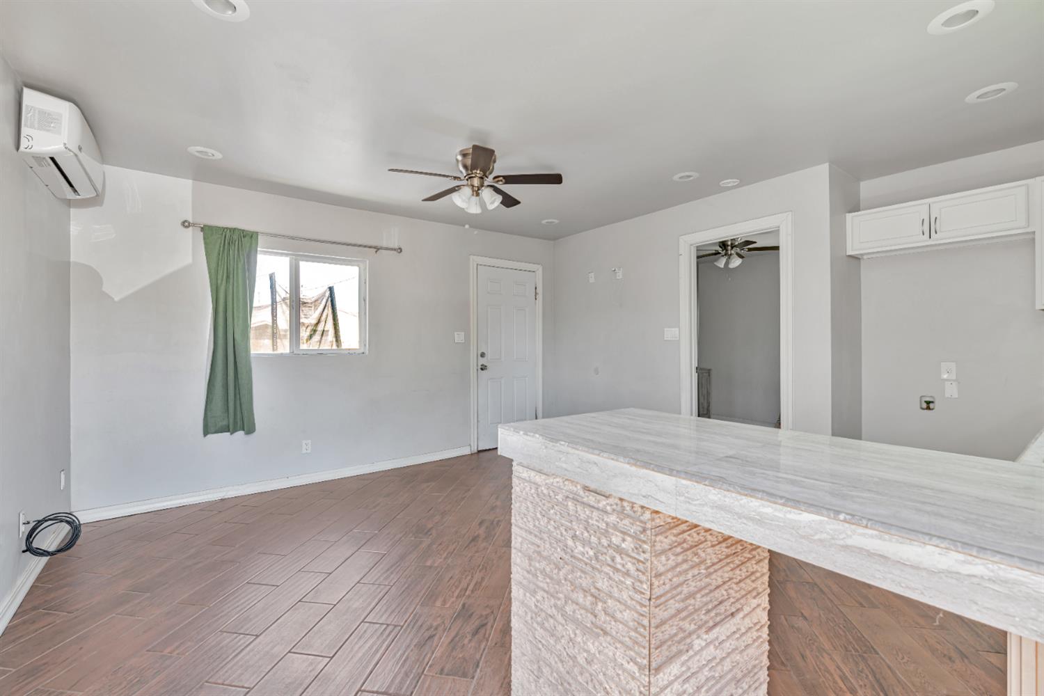 536 Locust Street Lodi, CA 95240 - Photo 4 of 18 a view of a livingroom with a ceiling fan window and wooden floor