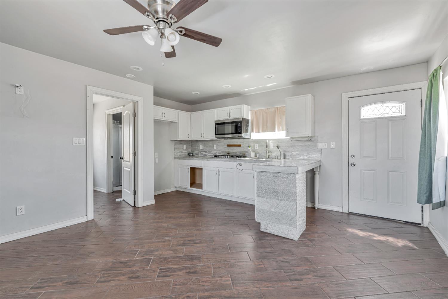 536 Locust Street Lodi, CA 95240 - Photo 5 of 18 a view of kitchen with granite countertop cabinets and refrigerator