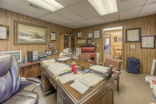 a bathroom with a toilet a sink and curtain