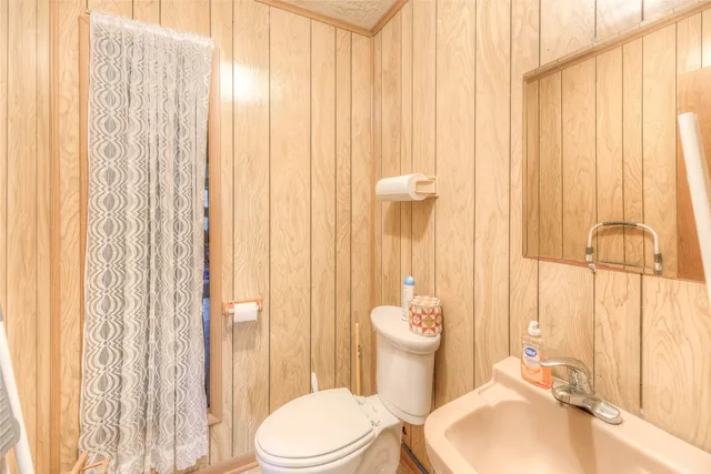 a living room with furniture and a kitchen