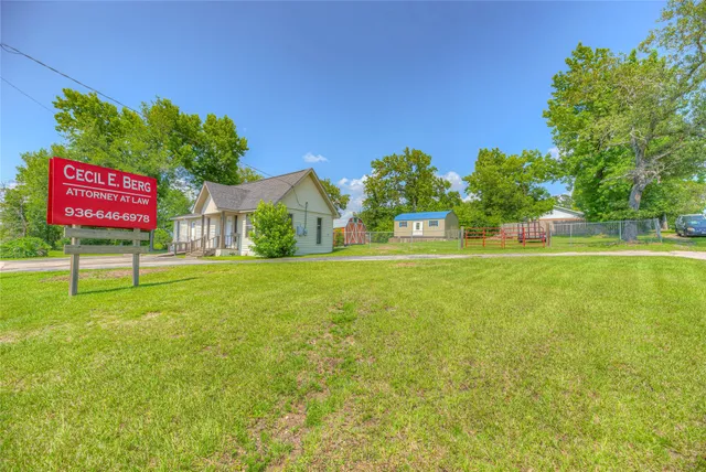 a backyard of a house with plants and a garden