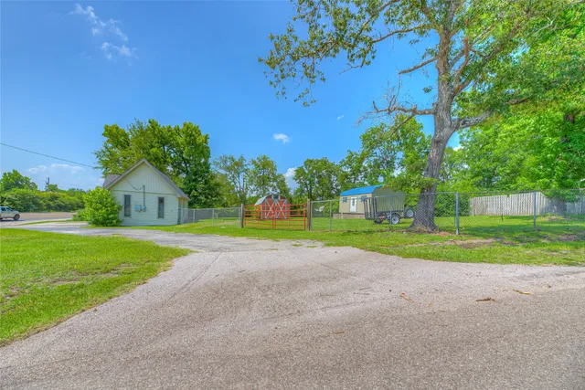 a backyard of a house with lots of green space