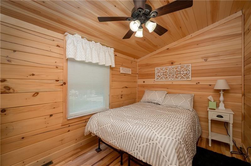 3906 Master Road Emlenton, PA 16373 - Photo 19 of 31 a bedroom with a bed and a chandelier