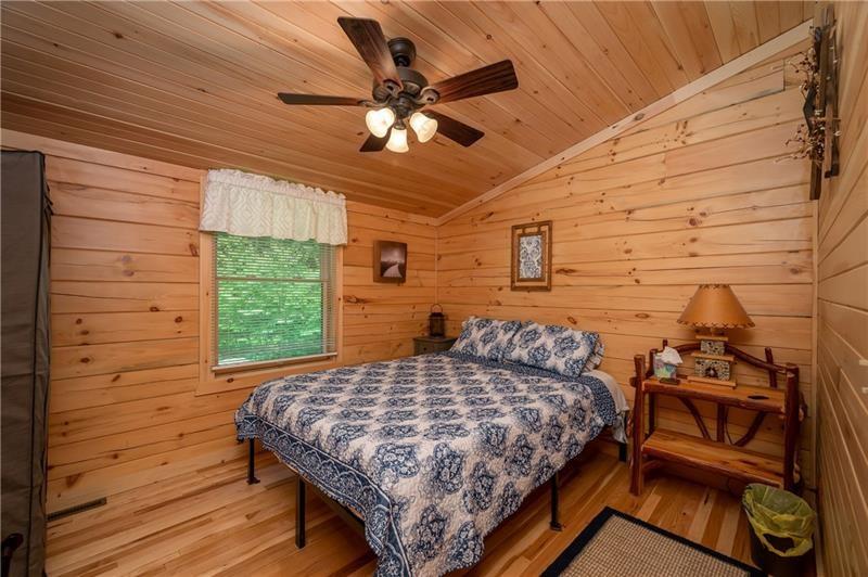 3906 Master Road Emlenton, PA 16373 - Photo 20 of 31 a bedroom with a bed and a chandelier