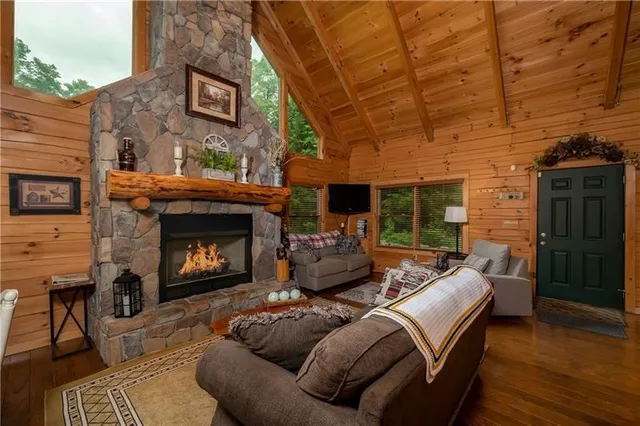 a living room with furniture and a fireplace