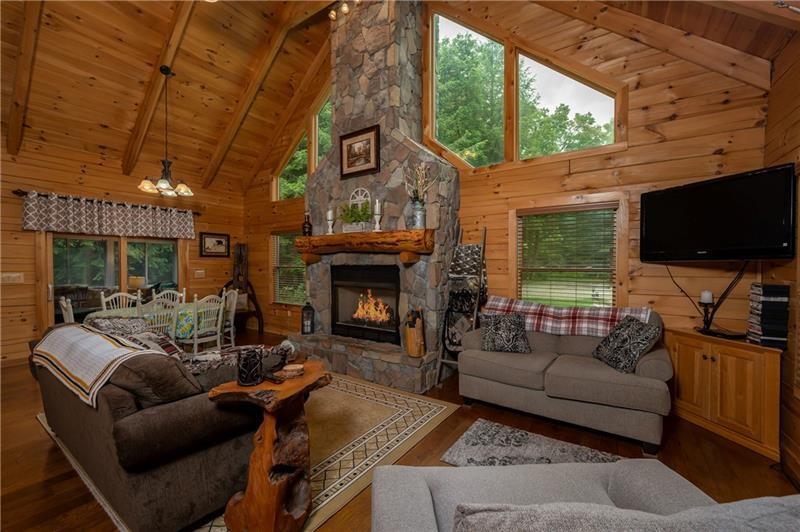 3906 Master Road Emlenton, PA 16373 - Photo 6 of 31 a living room with furniture a flat screen tv and a fireplace