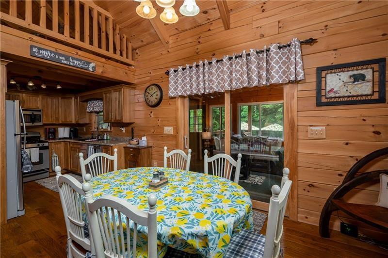3906 Master Road Emlenton, PA 16373 - Photo 8 of 31 a dining room with furniture a rug and wooden floor