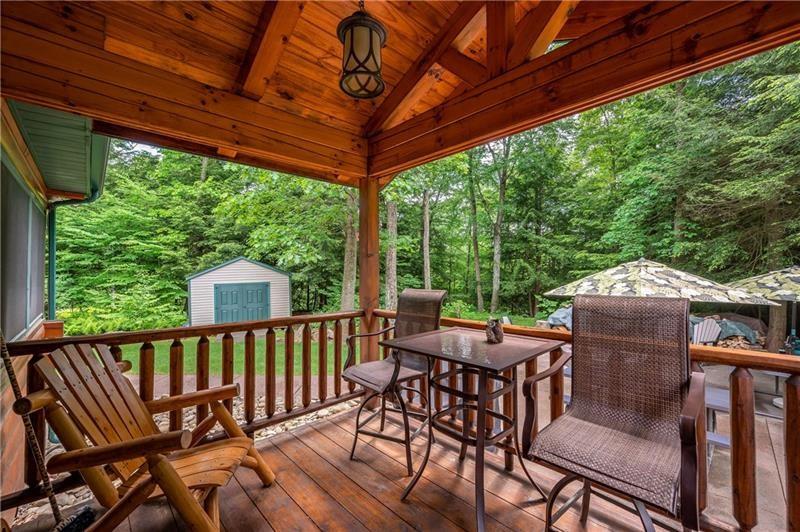 3906 Master Road Emlenton, PA 16373 - Photo 10 of 31 a view of a patio with a table chairs and a backyard