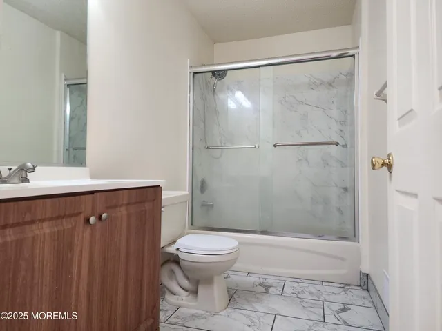 a bathroom with a shower and a toilet