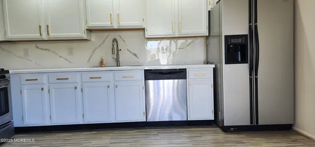a view of cabinets and wooden floor