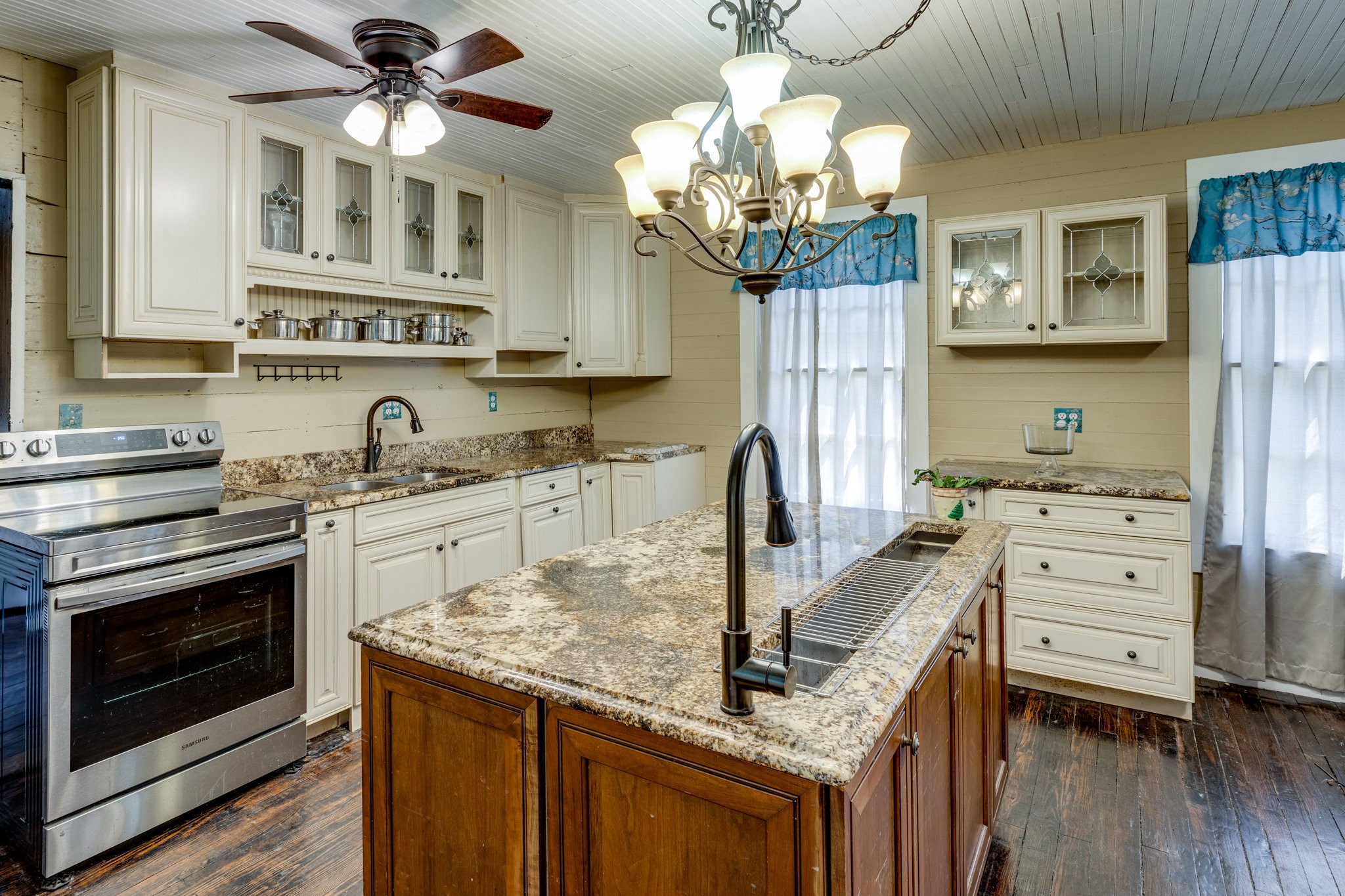 2012 Hoovers Road Duck River, TN 38454 - Photo 16 of 48 a kitchen with stainless steel appliances granite countertop a sink dishwasher and a stove with wooden floor