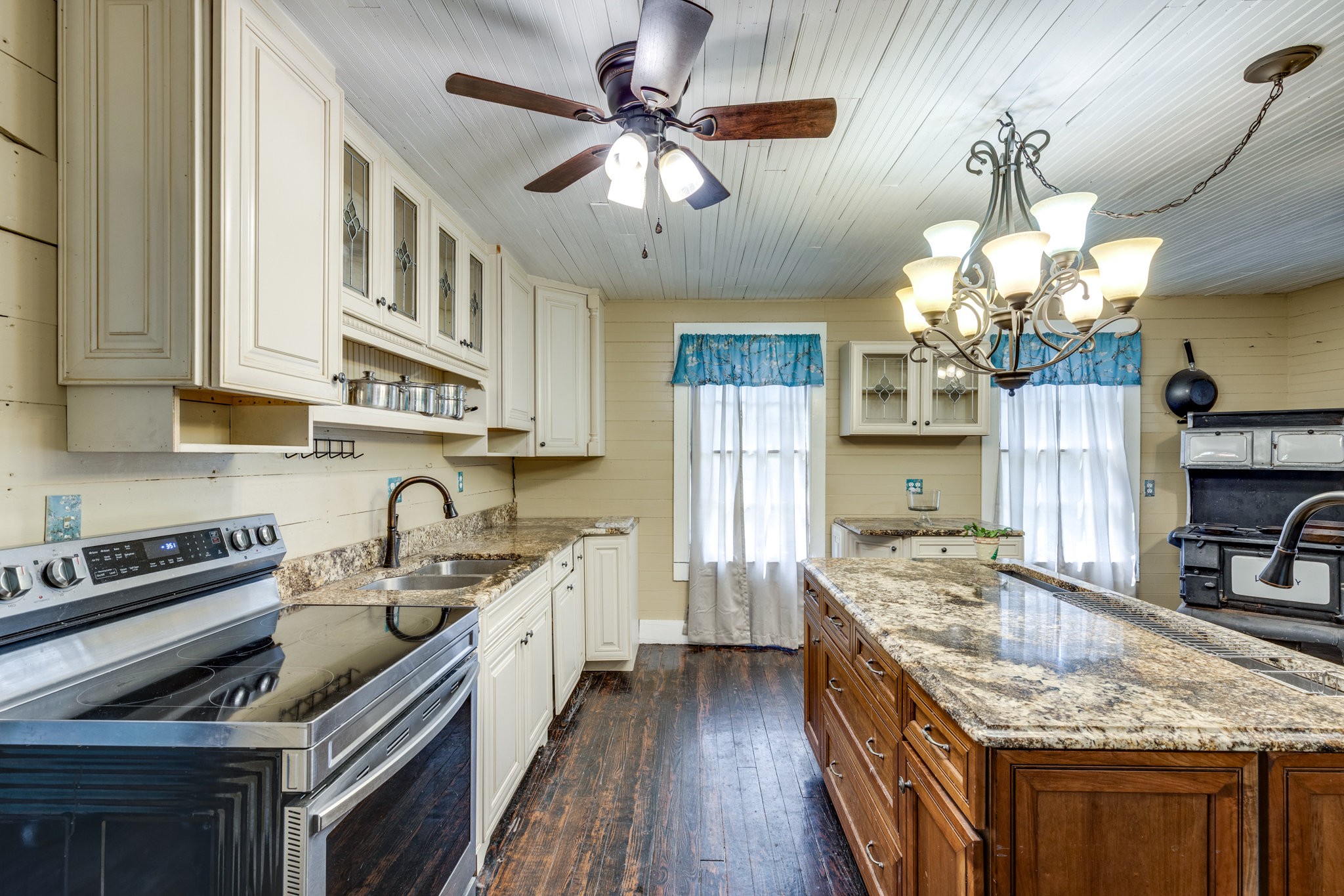 2012 Hoovers Road Duck River, TN 38454 - Photo 17 of 48 a kitchen with a stove sink and cabinets