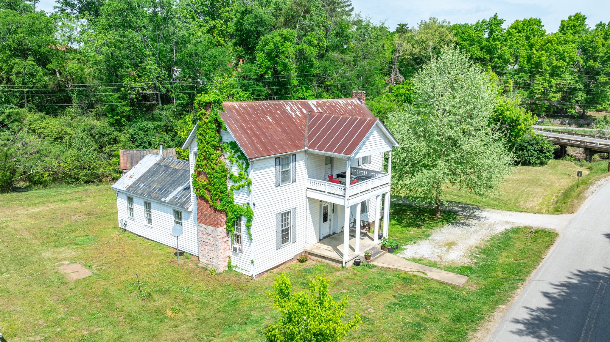 2012 Hoovers Road Duck River, TN 38454 - Photo 2 of 48 a aerial view of a house with a yard table and chairs