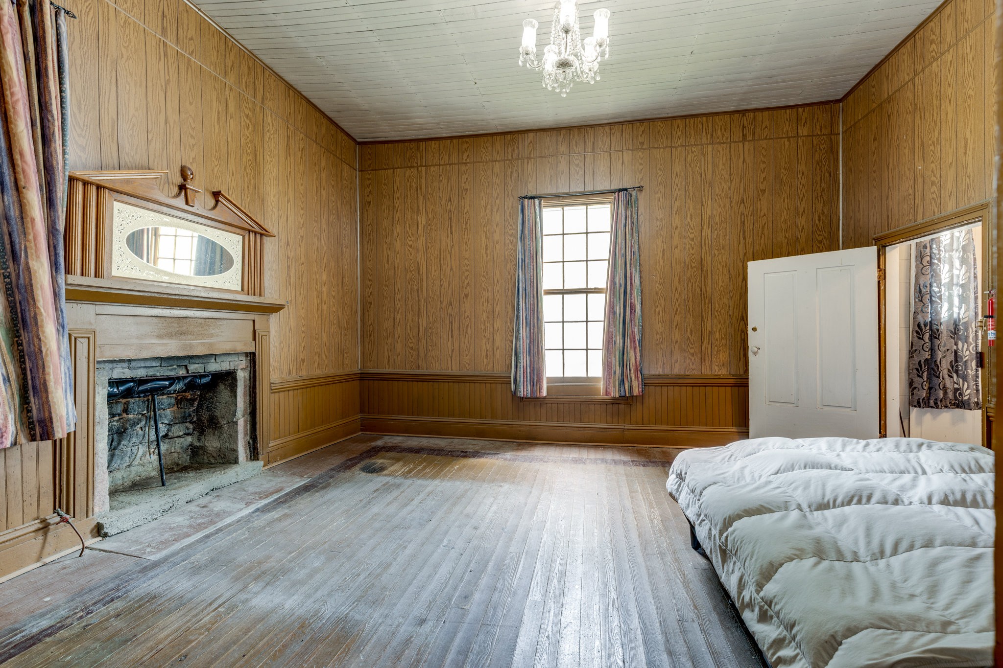 2012 Hoovers Road Duck River, TN 38454 - Photo 21 of 48 a bedroom with a bed and a fireplace