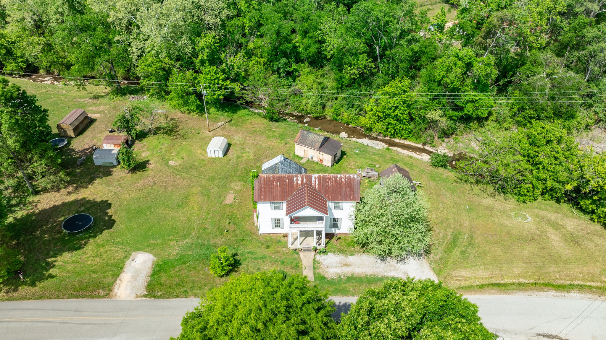 2012 Hoovers Road Duck River, TN 38454 - Photo 40 of 48 an aerial view of a house with a yard basket ball court and outdoor seating