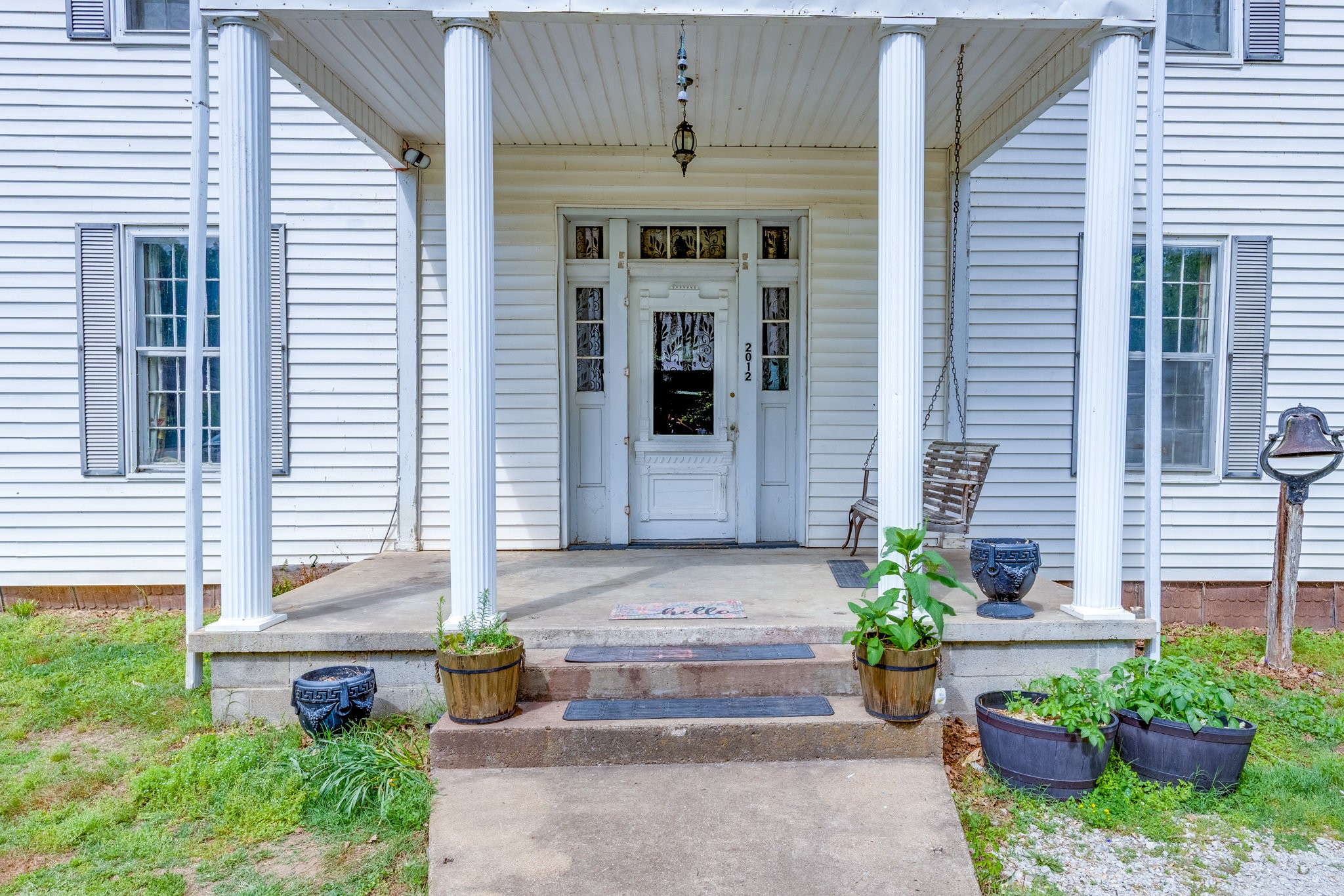 2012 Hoovers Road Duck River, TN 38454 - Photo 8 of 48 a front view of a house with sitting area