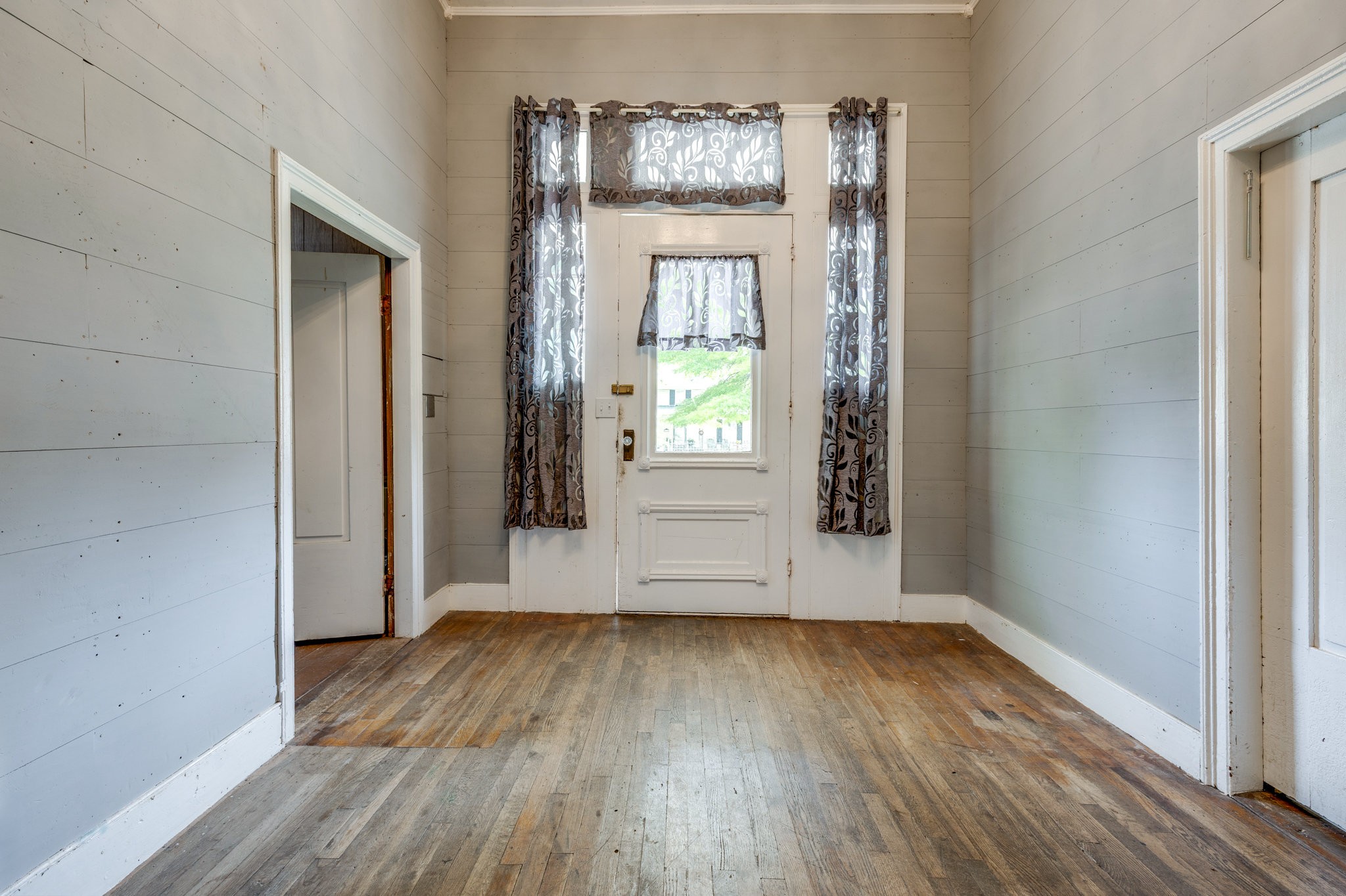 2012 Hoovers Road Duck River, TN 38454 - Photo 10 of 48 an empty room with wooden floor and windows