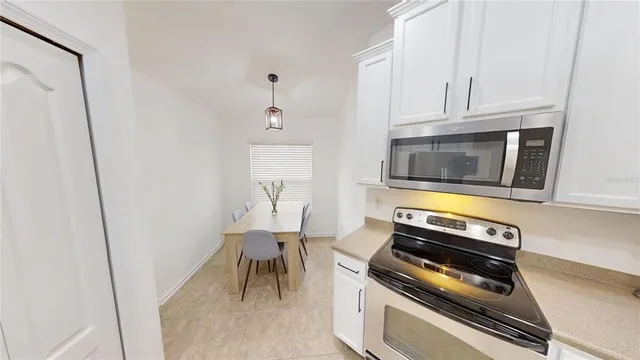 a kitchen with a stove and a microwave