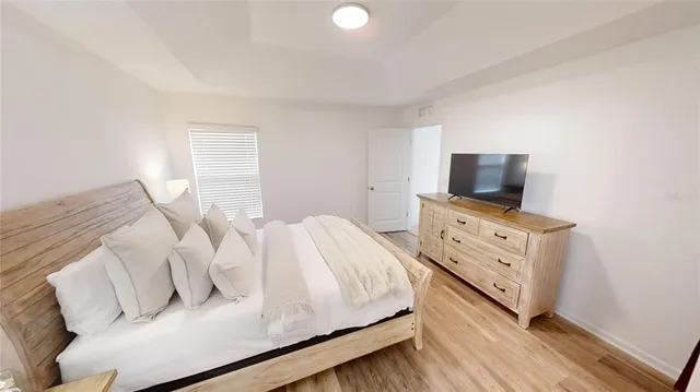 a bathroom with granite countertop a sink and a mirror