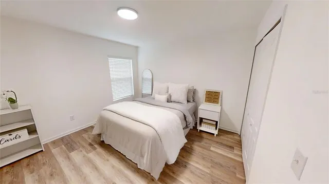 a bed room with a bed and a rug