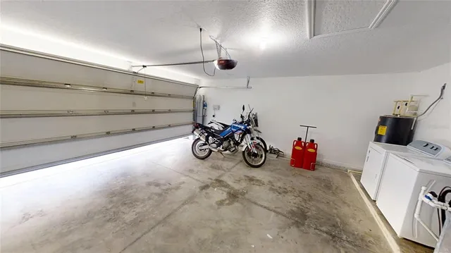 an aerial view of a house with a lake view