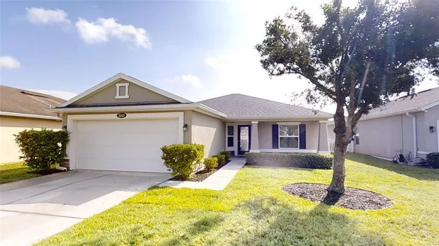 a front view of a house with a yard outdoor seating and yard